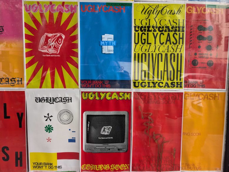 A grid of colorful posters, mostly reading "UGLYCASH" and "Your bank won't do this," with various graphic designs and fonts against a wall.