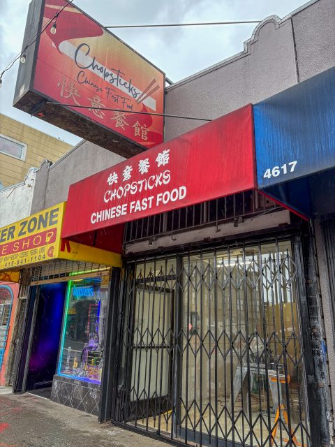 Storefront of "Chopsticks Chinese Fast Food" with a red awning and metal security gate, located at 4617. Nearby stores are visible on each side.