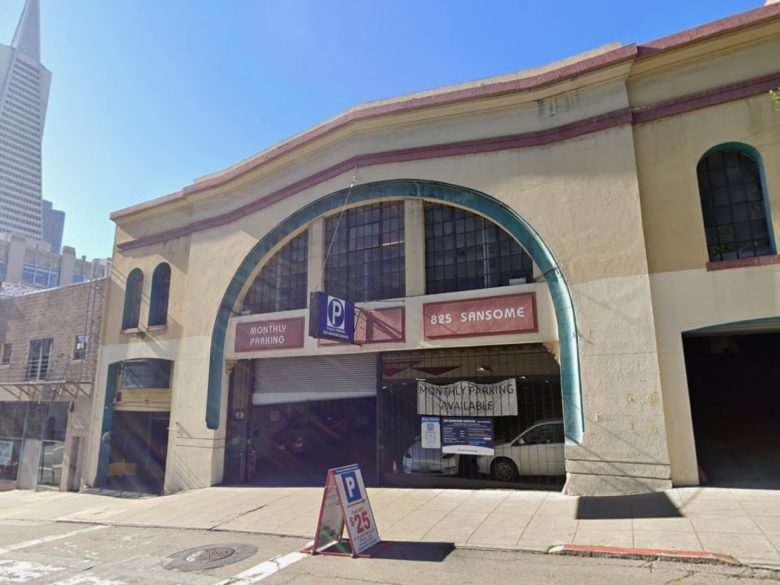 A two-story parking garage at 825 Sansome Street with signs for monthly parking and daily parking available; a sidewalk sandwich board advertises parking for $25.