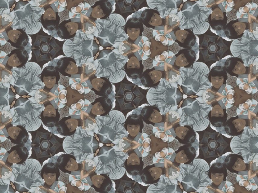 A kaleidoscopic pattern featuring repeated images of a young child with short dark hair, wearing a striped outfit, creating a symmetrical, geometric design.