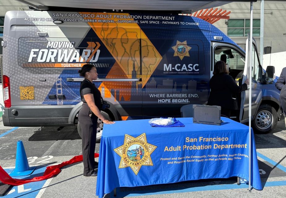 San Francisco Adult Probation Department staff at an outreach event with a branded van and informational table.