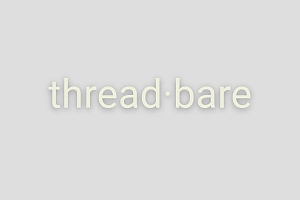 The word "threadbare" is written in lowercase white letters with a dot between "thread" and "bare" on a light gray background.