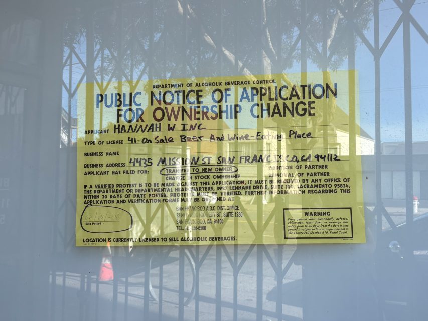 Yellow notice posted on glass announces Hannah W Inc's application to sell beer and wine at 4425 Mission St, San Francisco, CA, pending approval by Alcoholic Beverage Control.