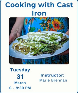 A person in a floral dress holds a plate of leafy green food topped with white sauce. Text promotes a "Cooking with Cast Iron" class on March 31, taught by Marie Brennan.