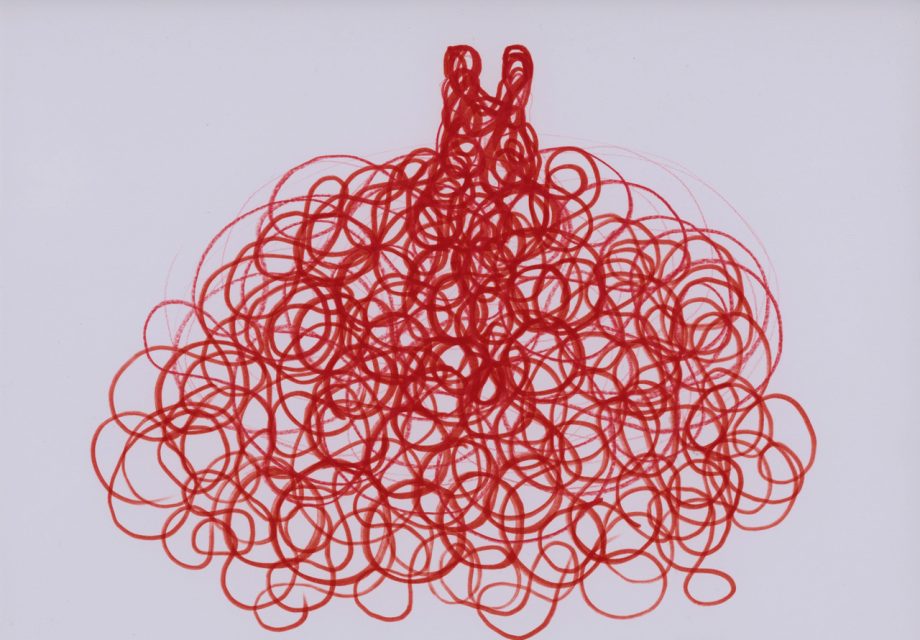 Red loops of ink or marker form a dense, tangled doodle resembling an abstract or stylized pom-pom shape on a plain white background.