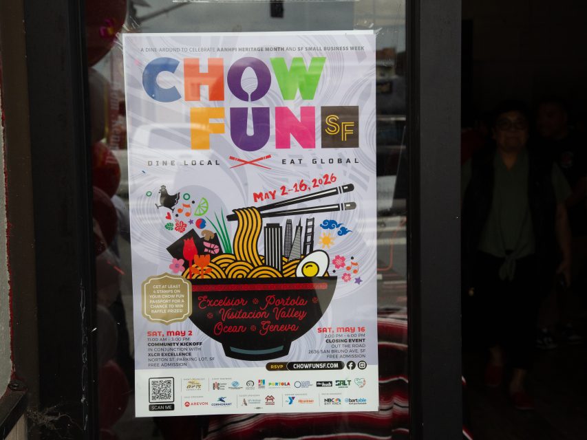 Poster on glass door advertising "Chow Fun SF," a food event happening May 2–16, 2026, with a bowl of noodles graphic and details about locations and dates.