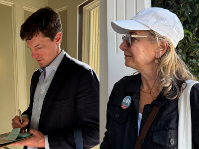 A man in a suit writes on a clipboard indoors, while a woman in a white cap and glasses stands outside, wearing a "LORI" campaign button.